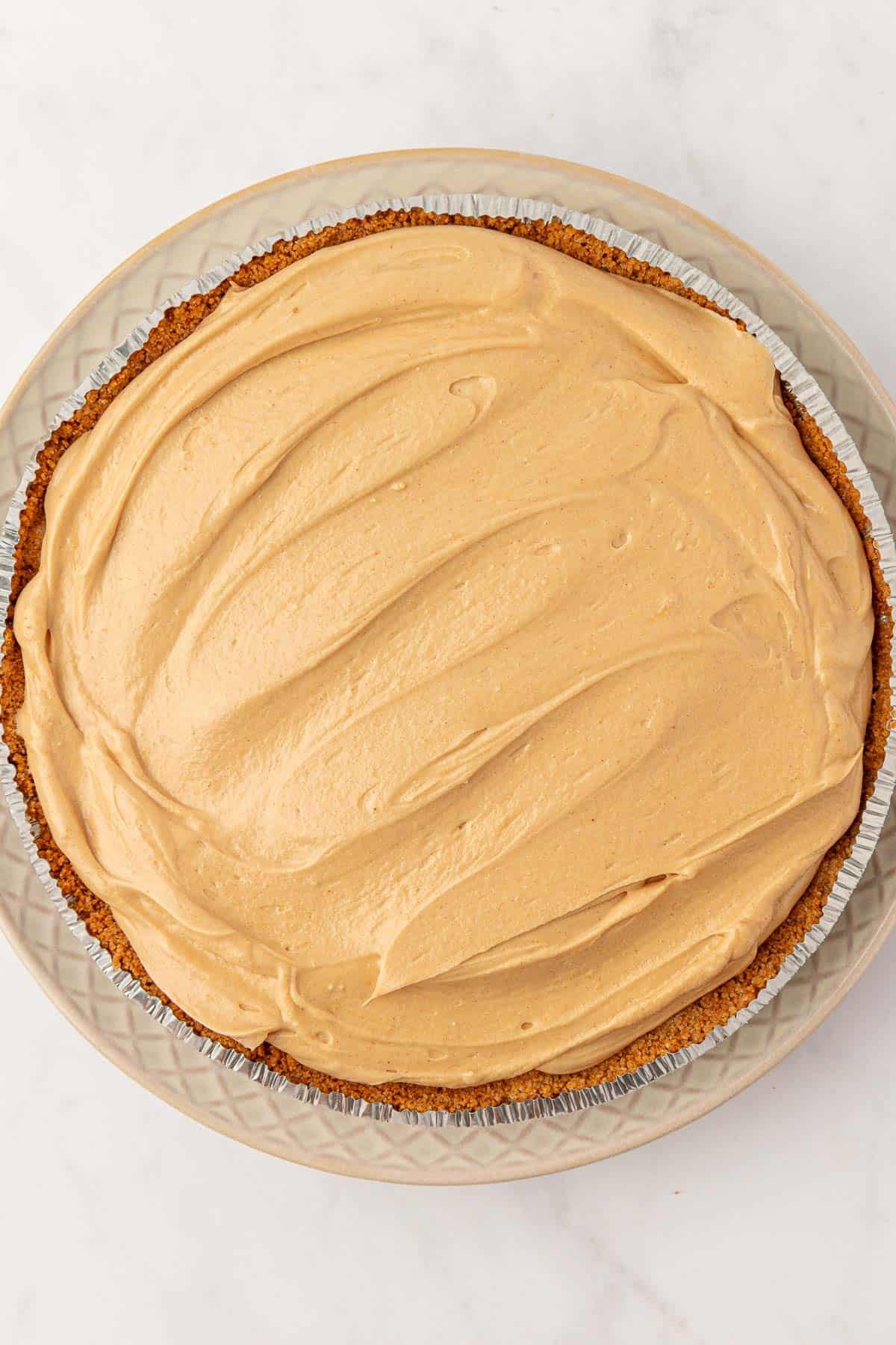 peanut butter filling spread into the crust