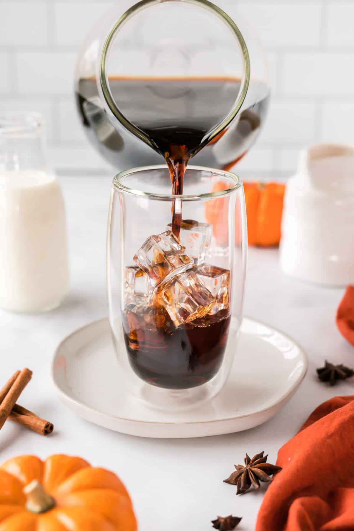 pouring cold brew coffee over the ice