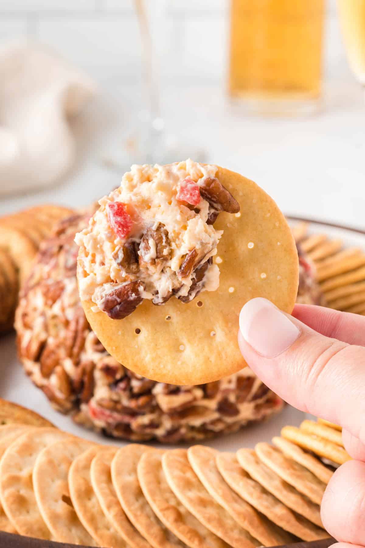 cracker with pimento cheese ball on it