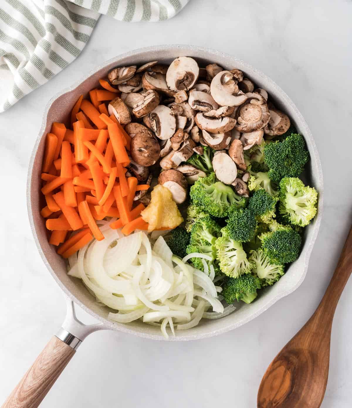 skillet full of raw vegetables for teriyaki stir fry