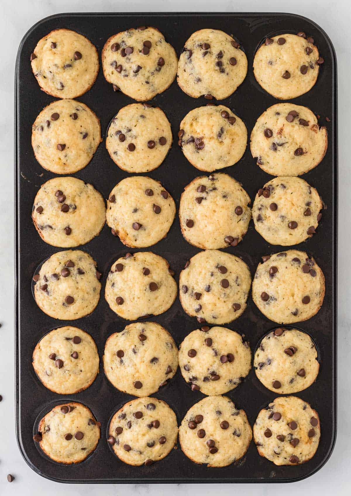 baked mini muffins in the tin