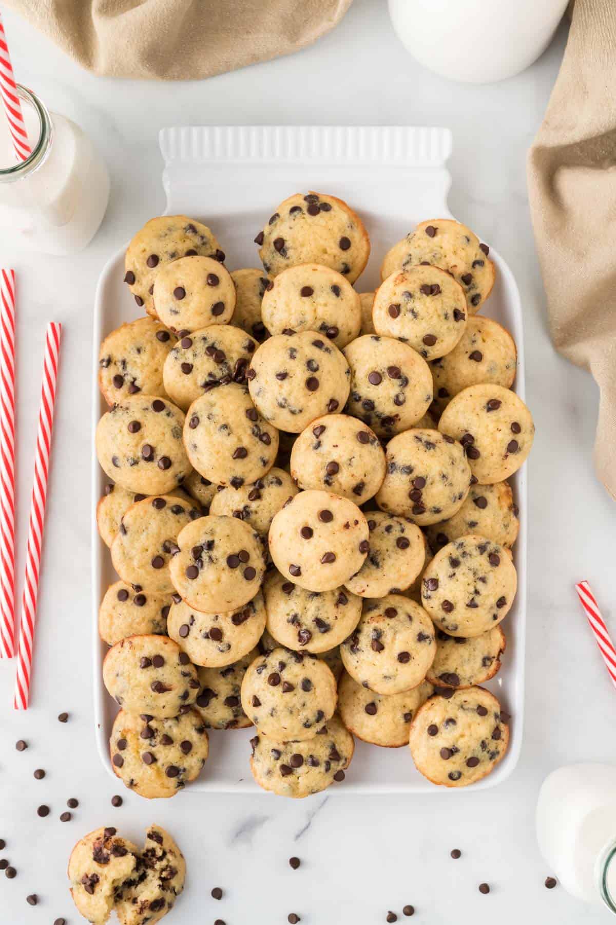 mini chocolate chip muffins stacked on a platter