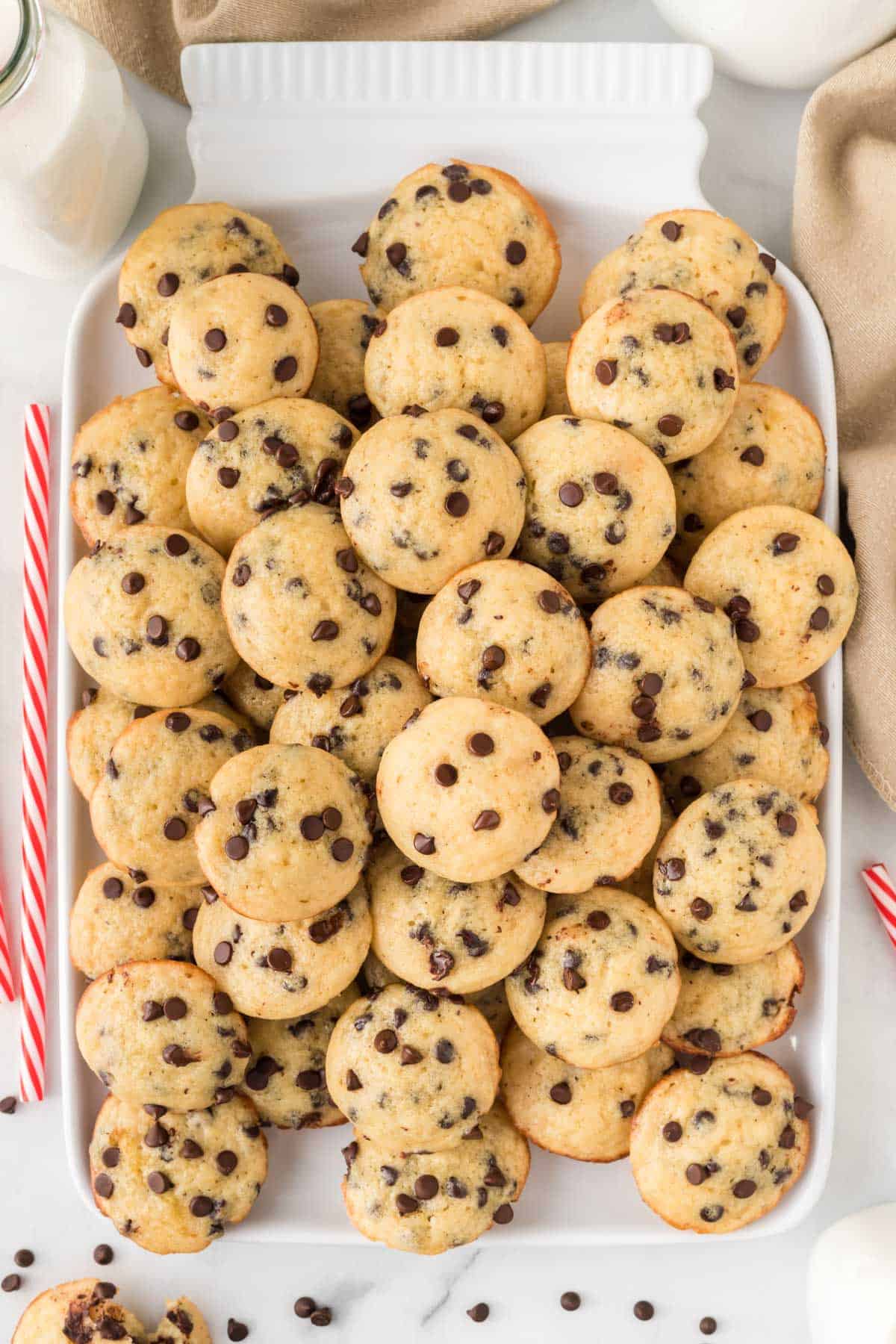 mini chocolate chip muffins stacked on a platter