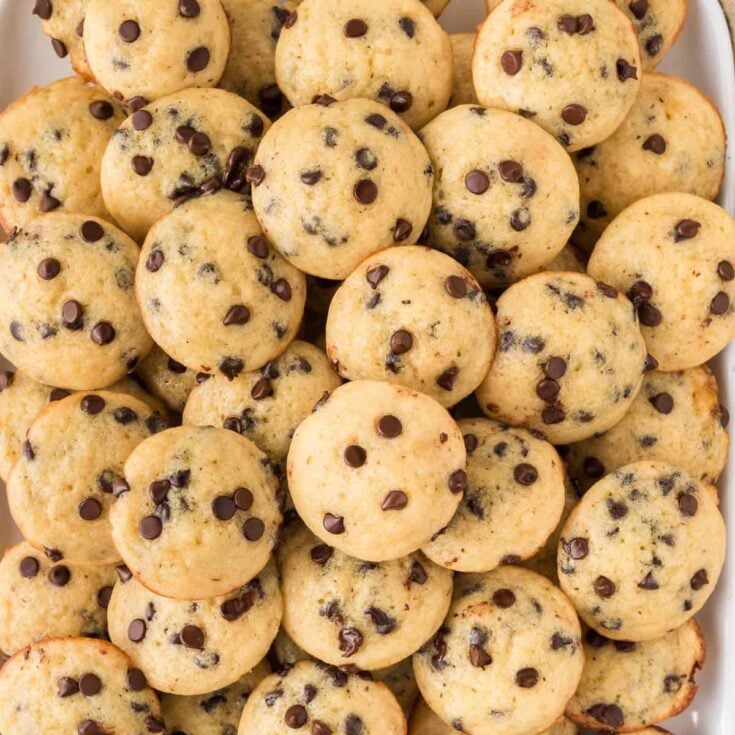 mini chocolate chip muffins stacked on a platter