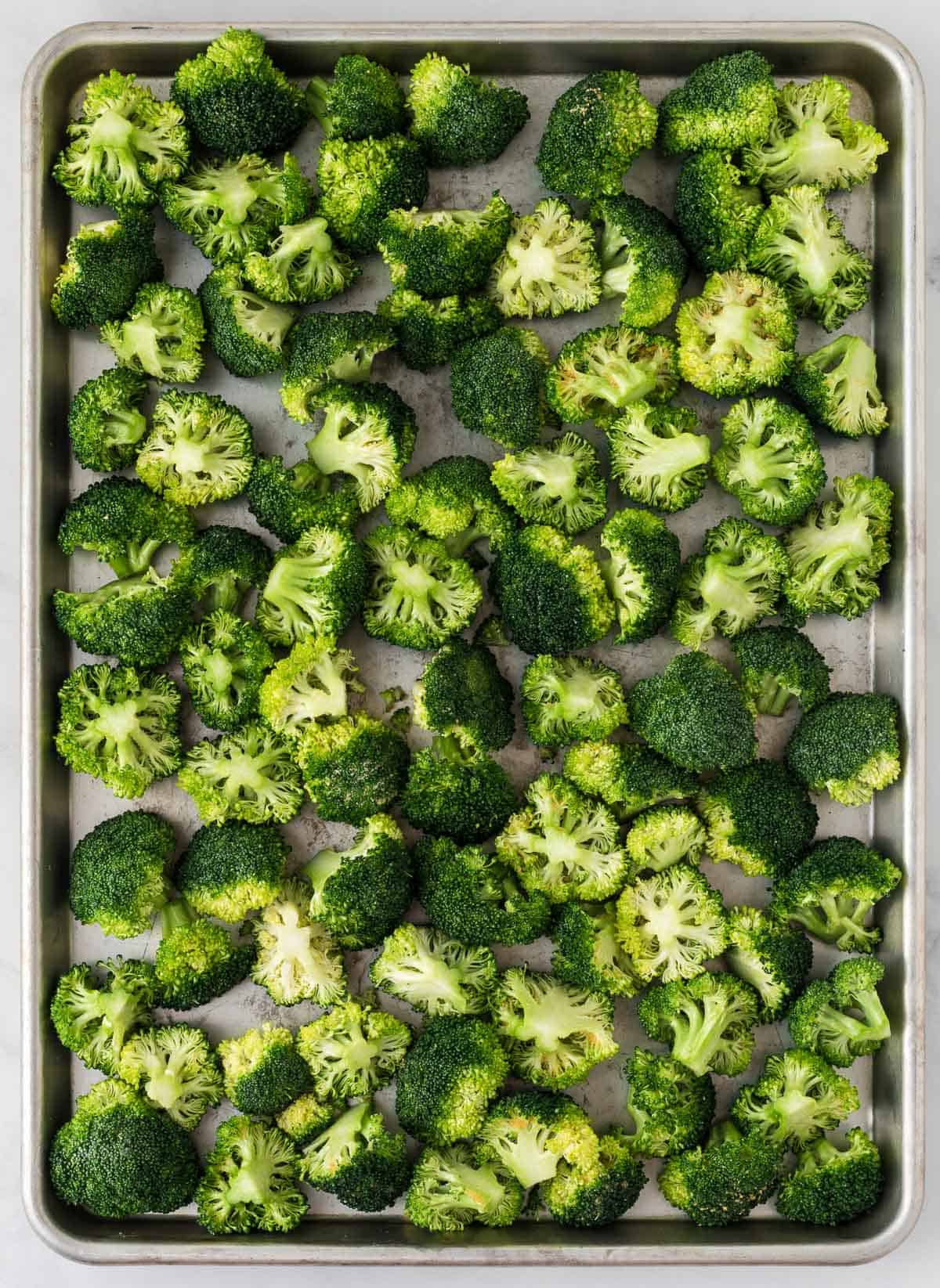 broccoli florets on the baking pan