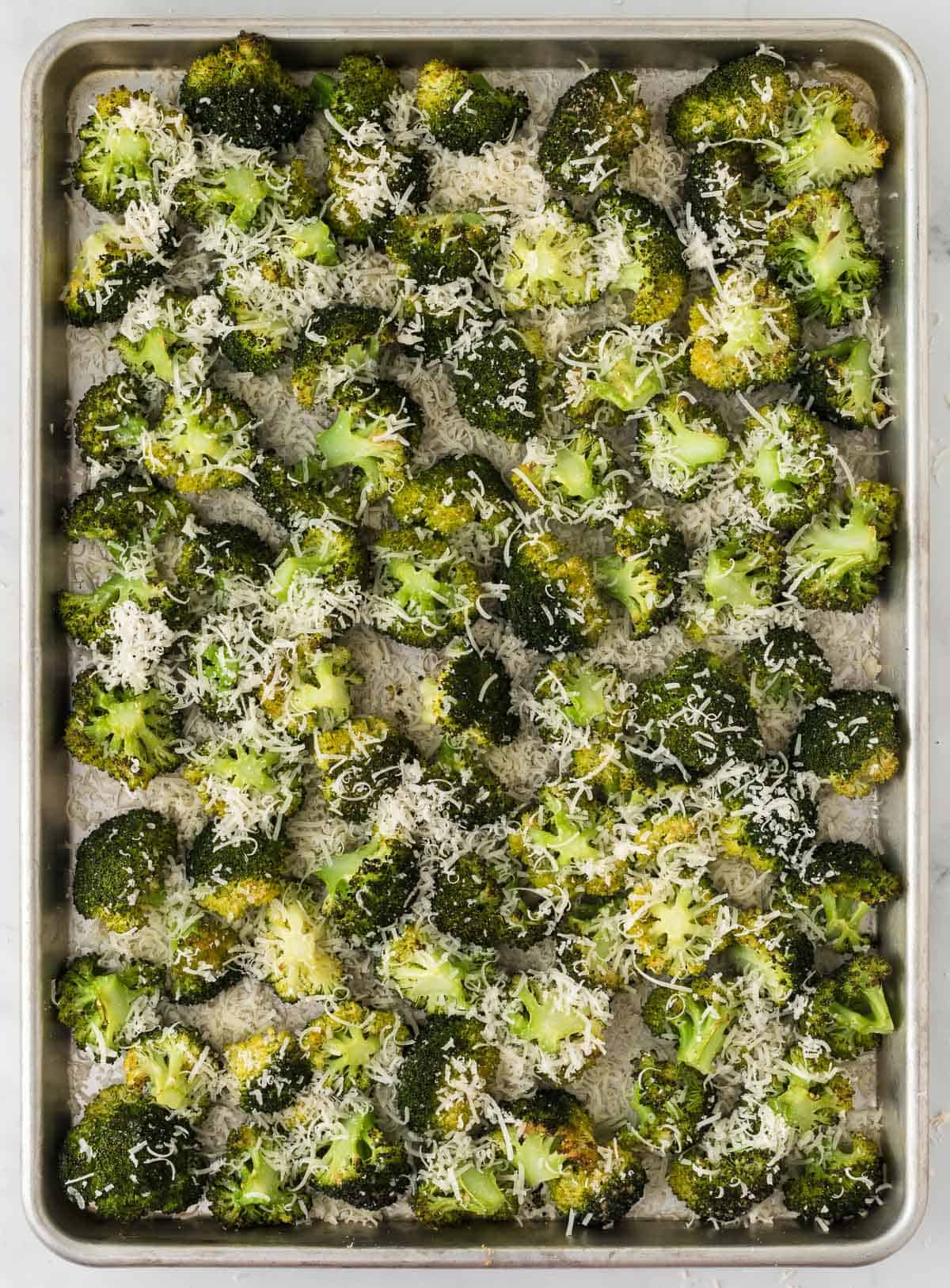 adding parmesan to the broccoli