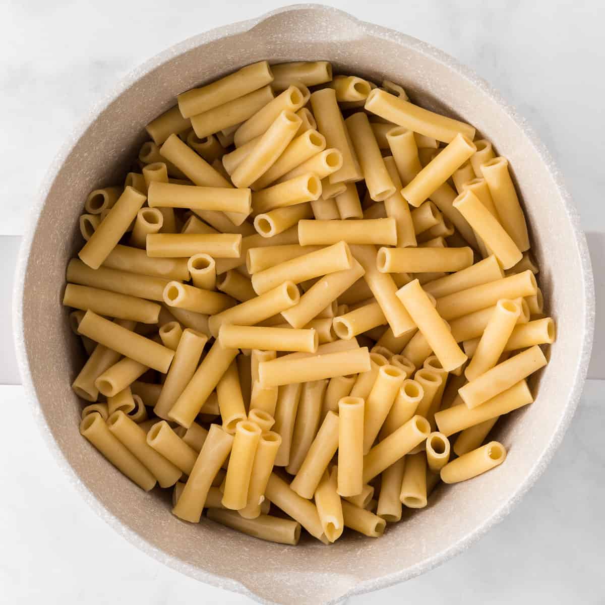 cooked ziti in a sauce pan