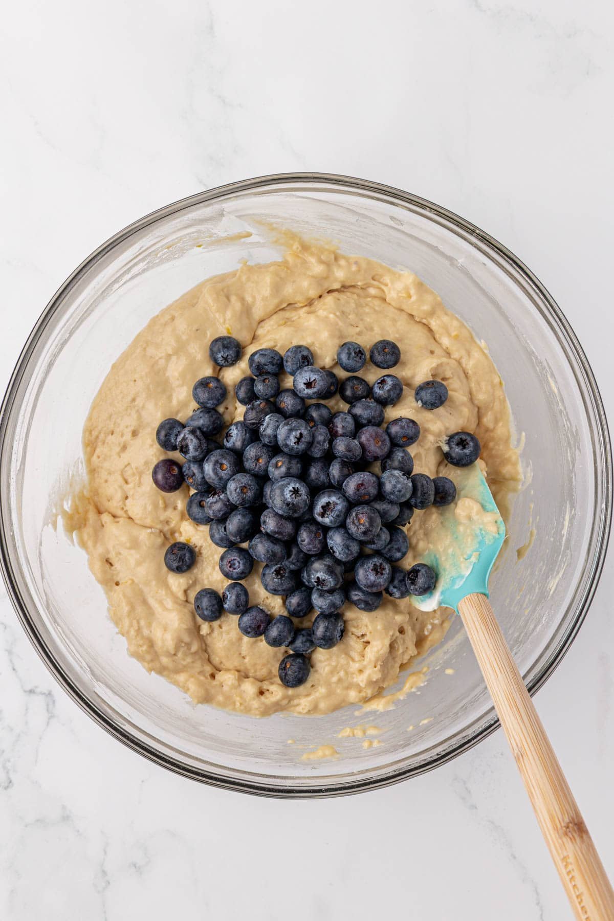 adding the blueberries to the batter