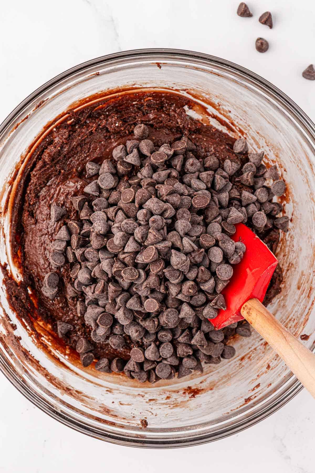 adding the chocolate chips to the batter