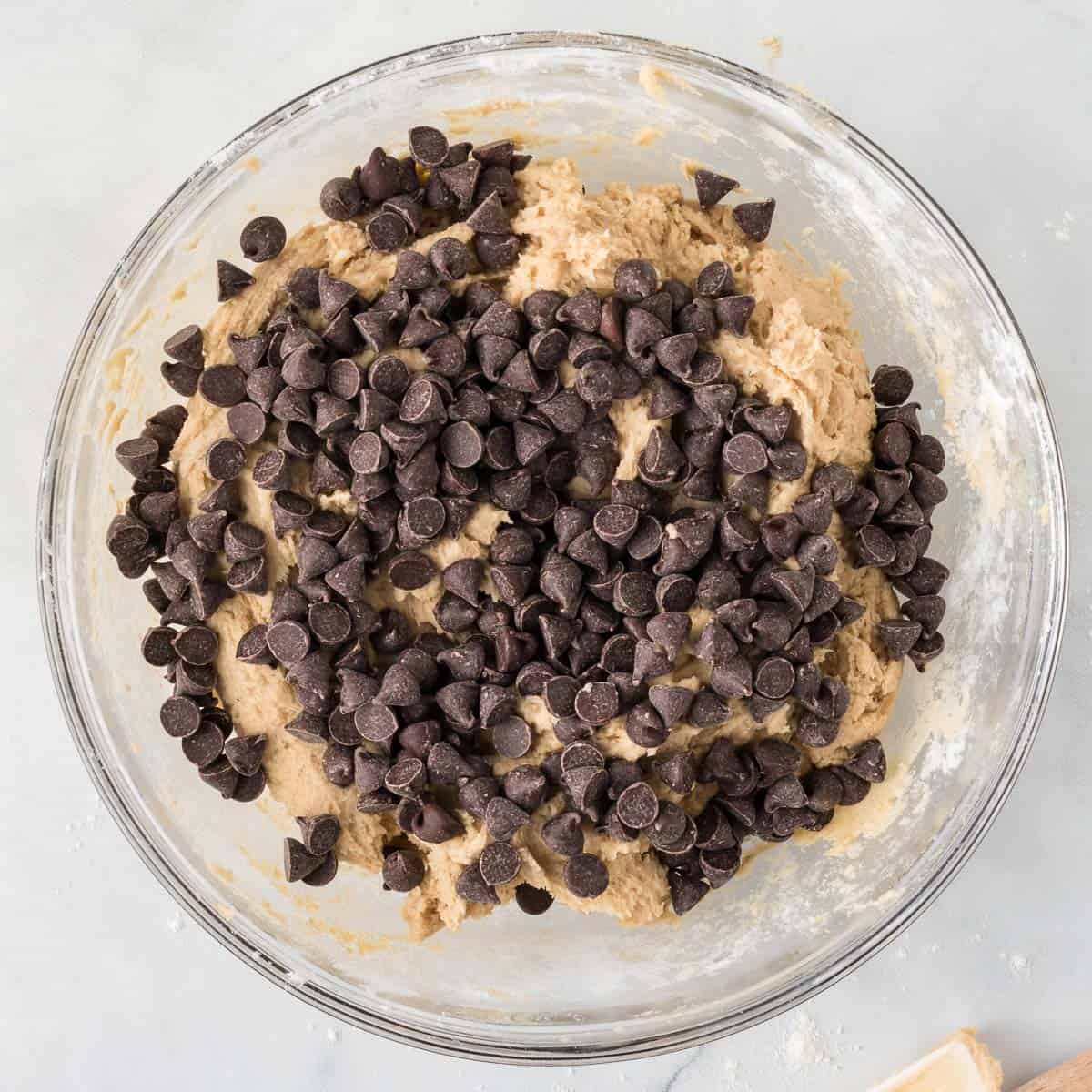 adding the chocolate chips to the cookie dough