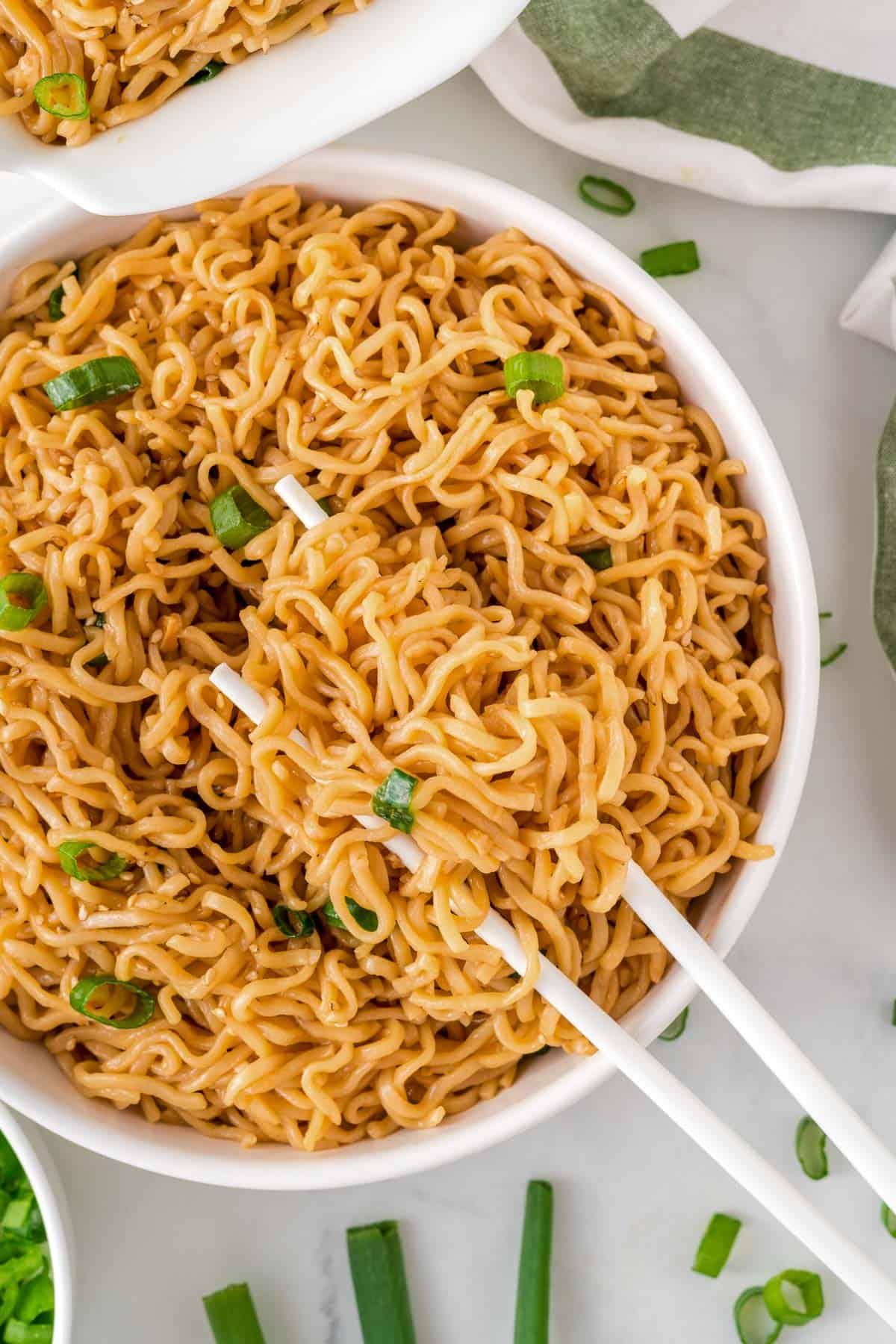 chopsticks in a bowl of ramen noodles