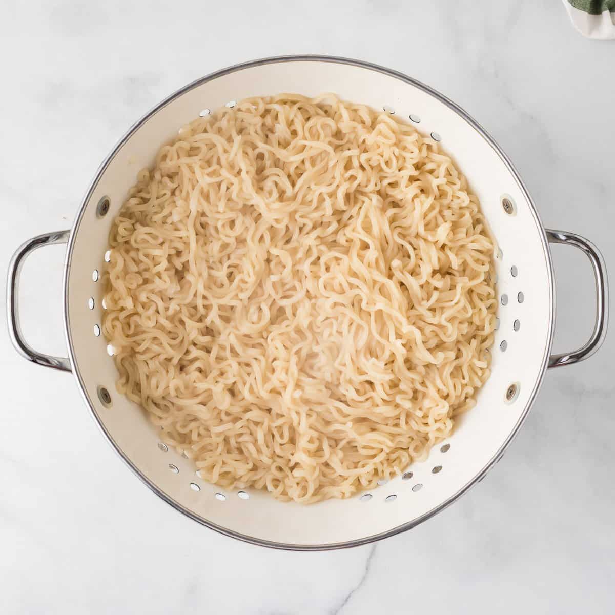 cooked ramen noodles in a strainer