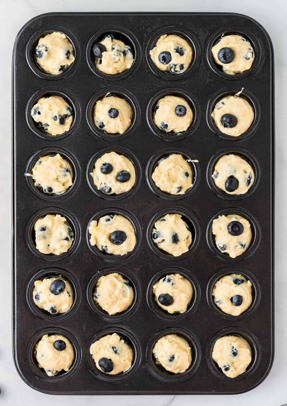 mini muffin tin filled with batter