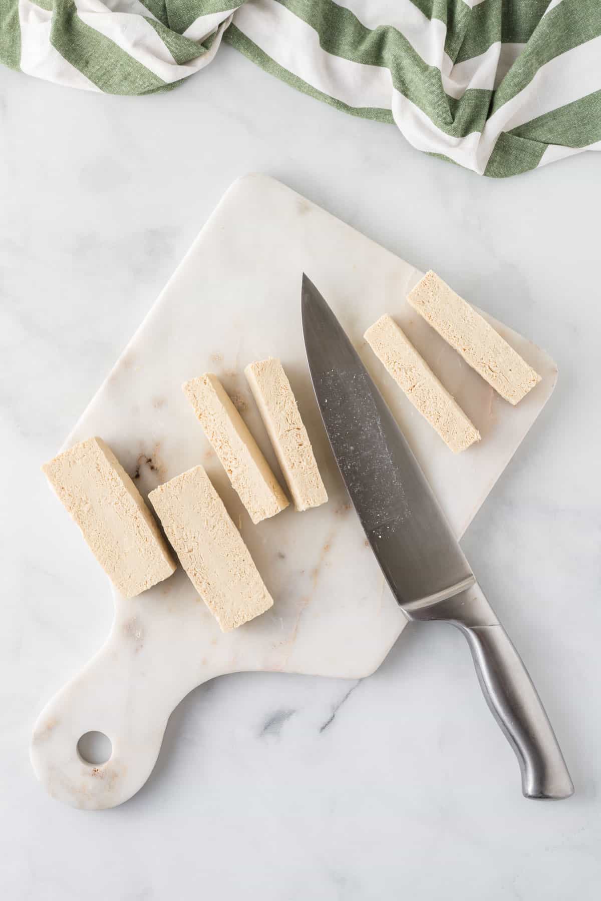 cutting the tofu into strips