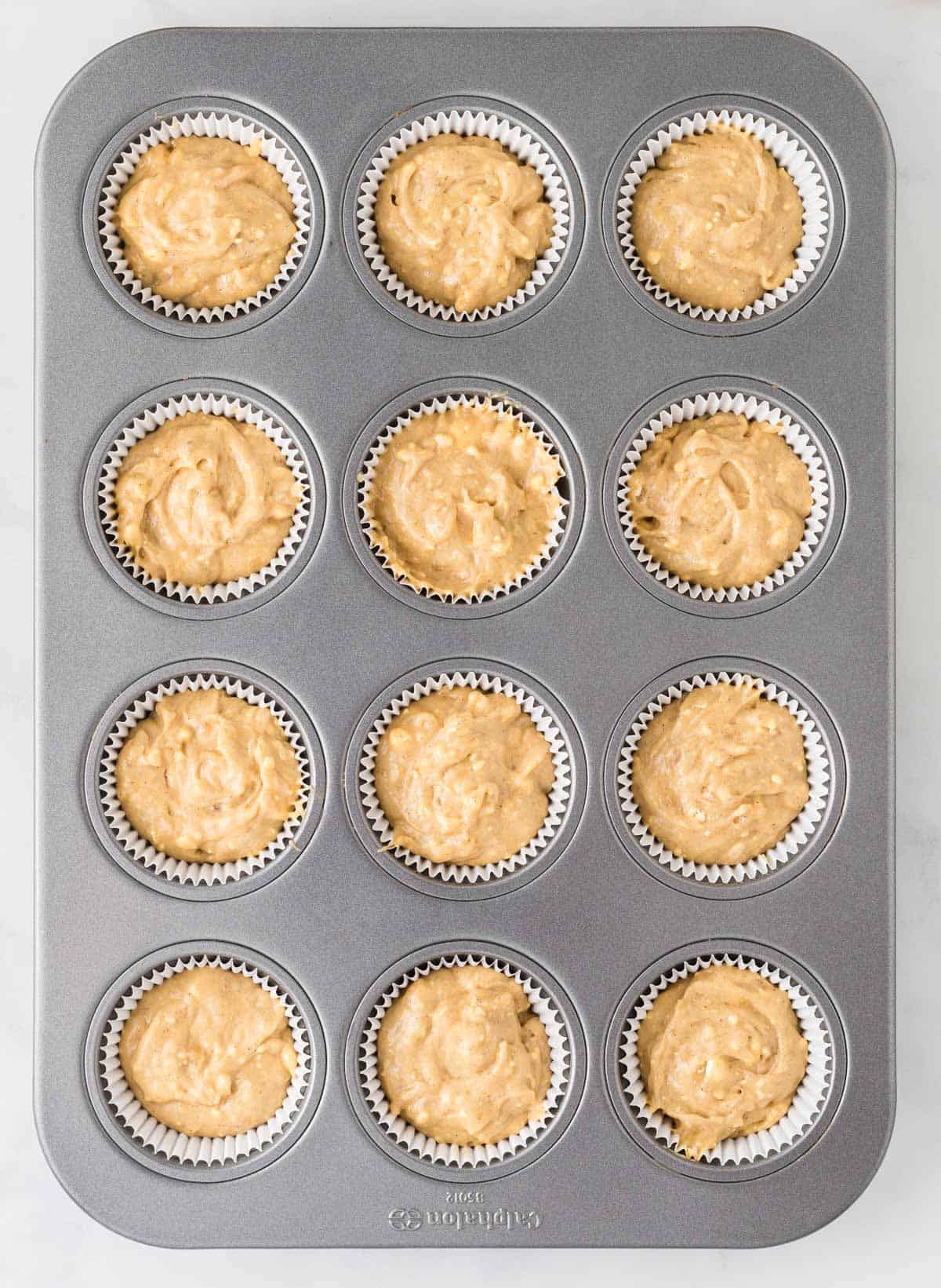 muffin batter in the muffin tin