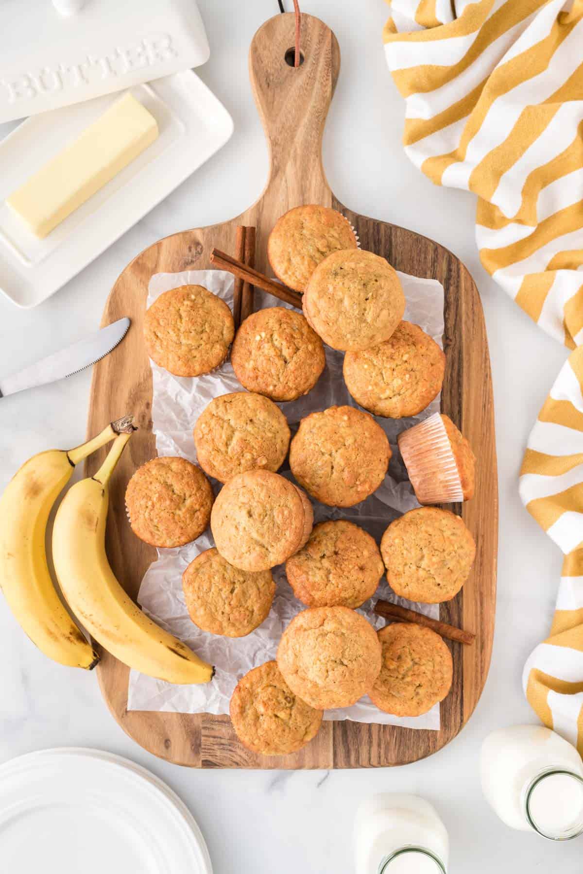 cake mix banana muffins on a wooden cutting board