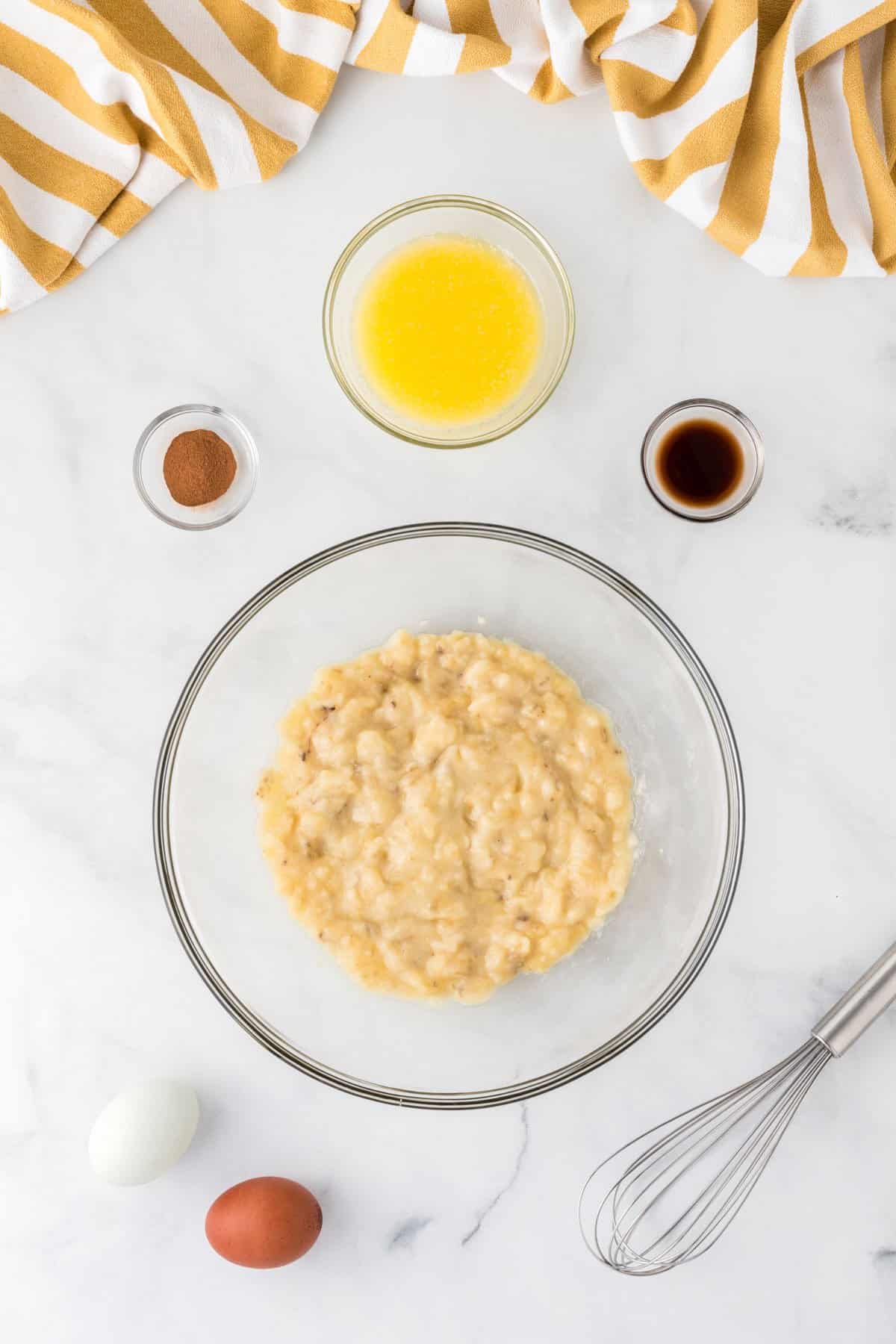 mashed banana, two eggs, melted butter, vanilla extract, and cinnamon