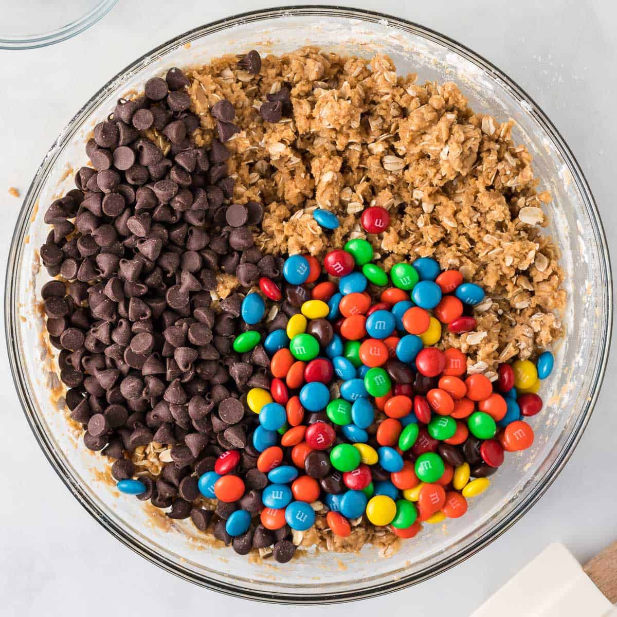 adding the chocolate chips and M&M's to the batter