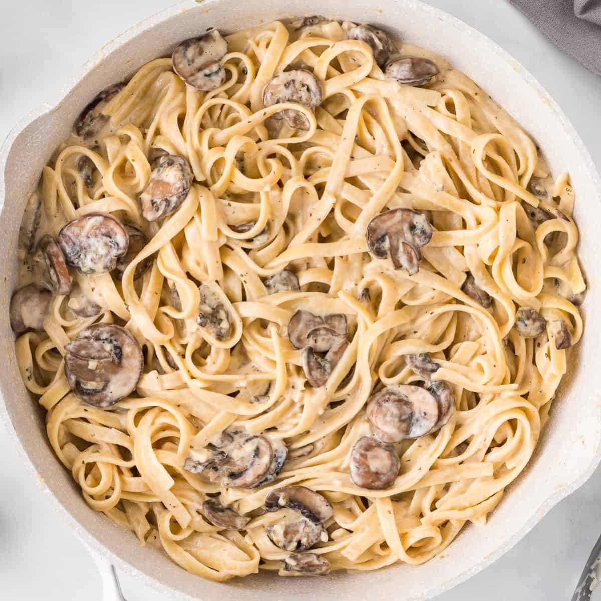creamy mushroom pasta in a skillet