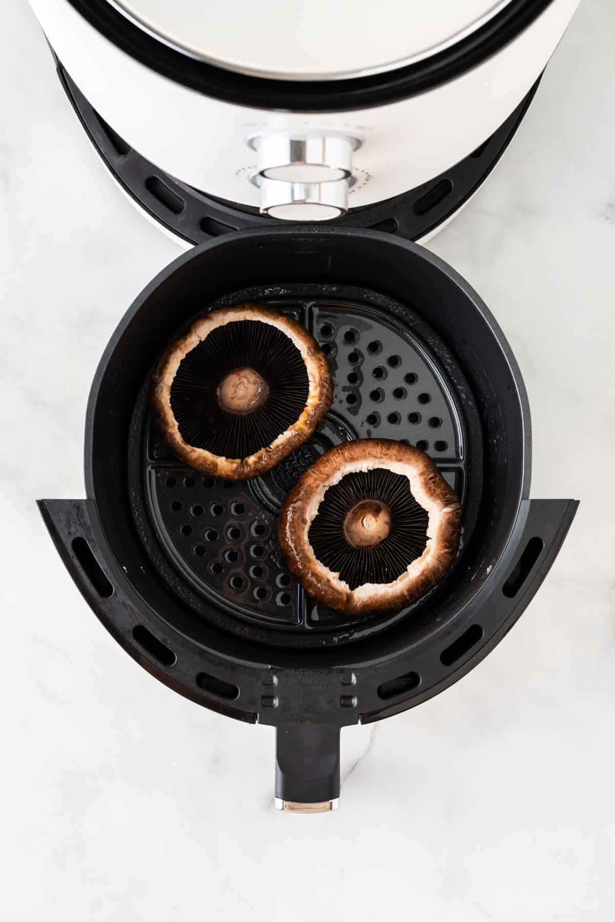 adding the portobello mushrooms to the air fryer