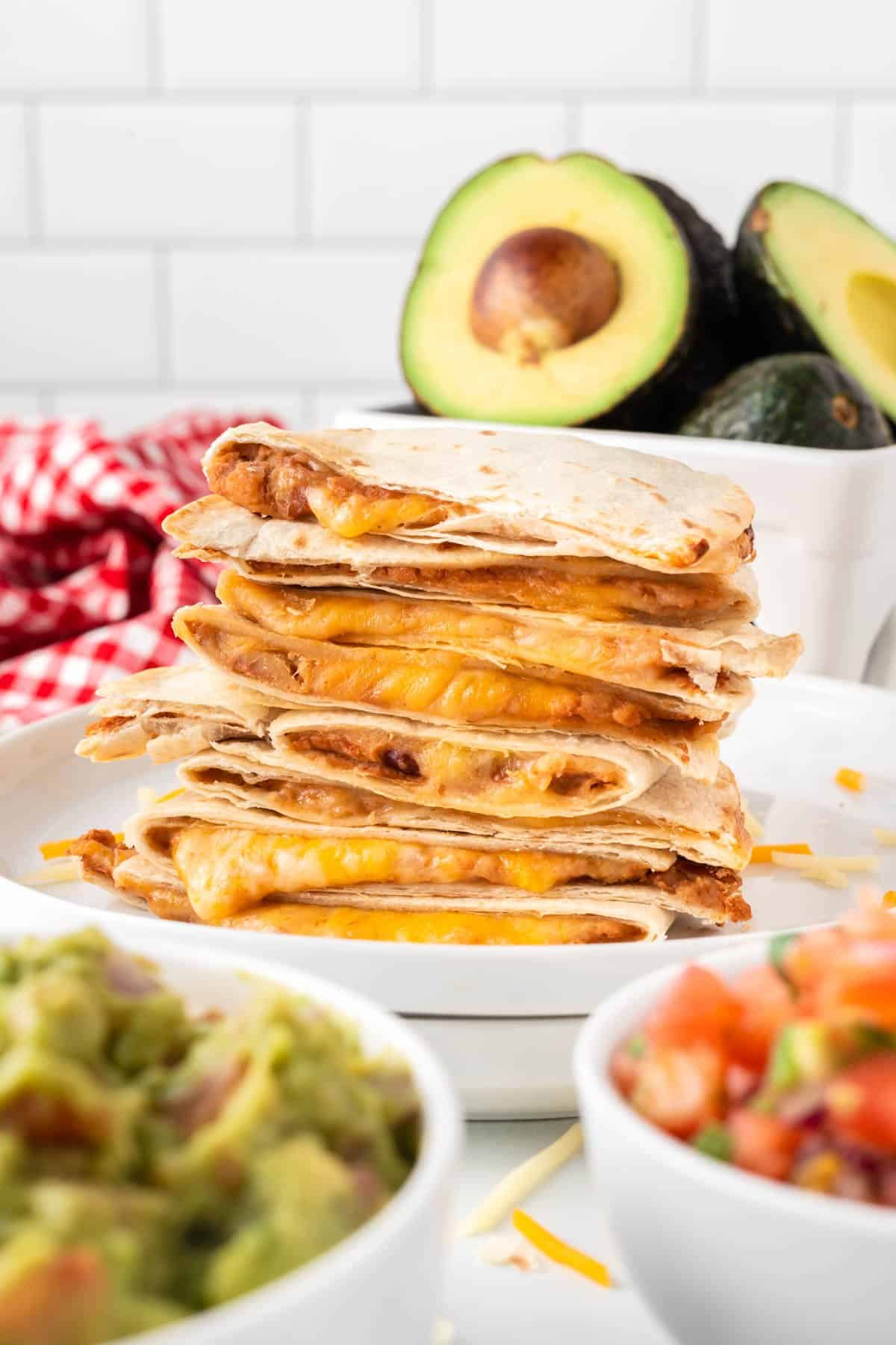 air fryer quesadillas stacked on a plate