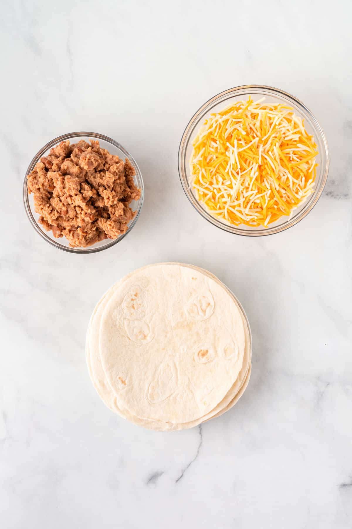 soft taco shells, refried beans, and mexican cheese