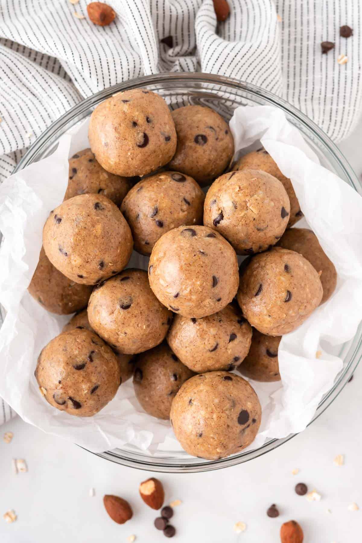 almond butter protein balls stacked in a bowl