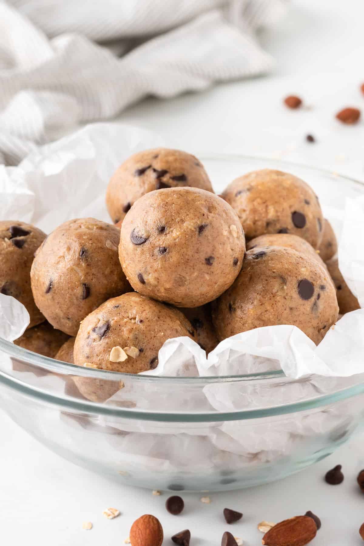 almond butter protein balls stacked in a bowl