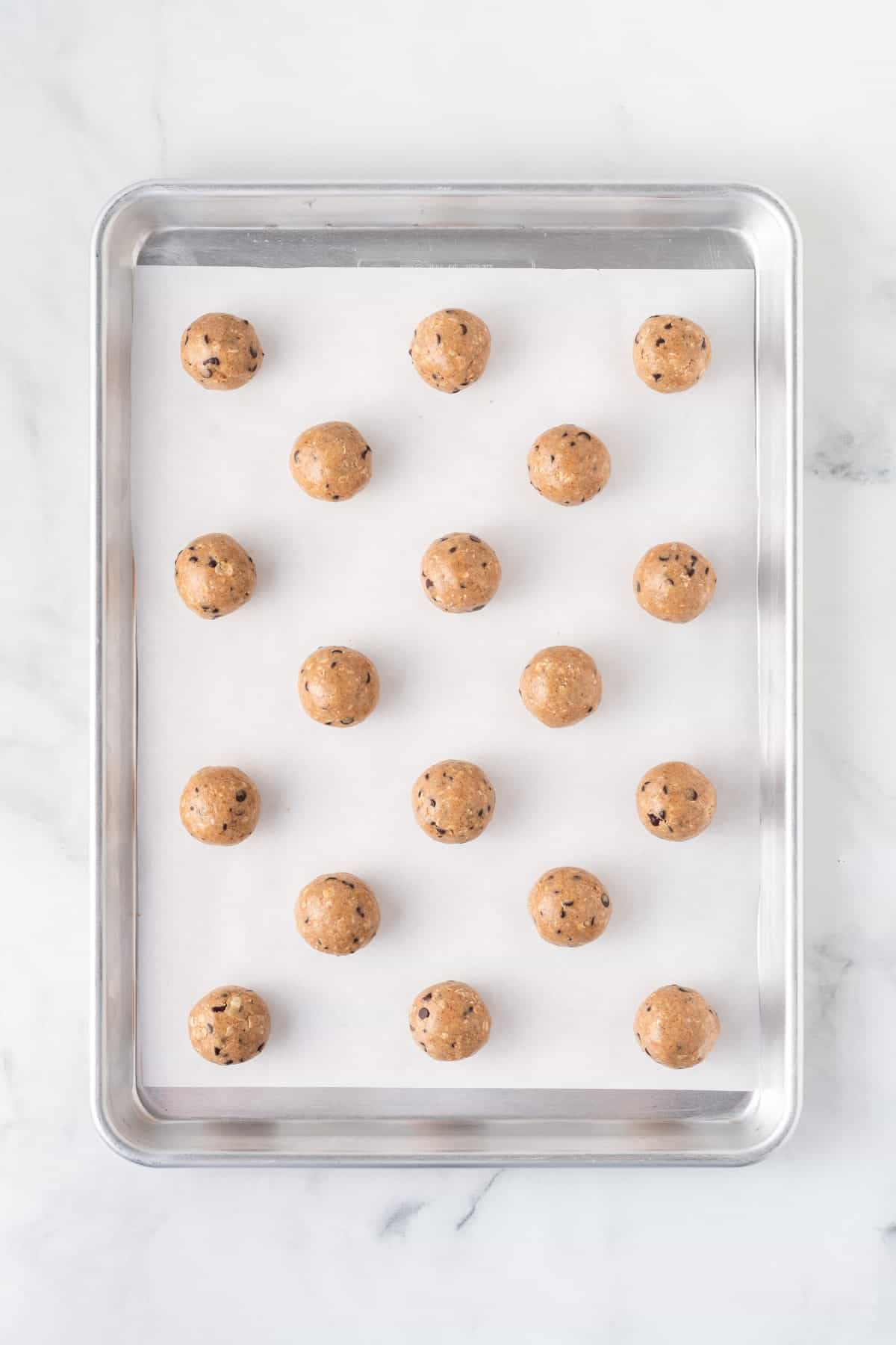 almond butter energy balls on a baking sheet