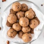 almond butter protein balls stacked in a bowl