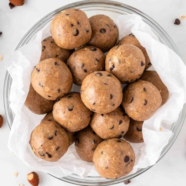 almond butter protein balls stacked in a bowl