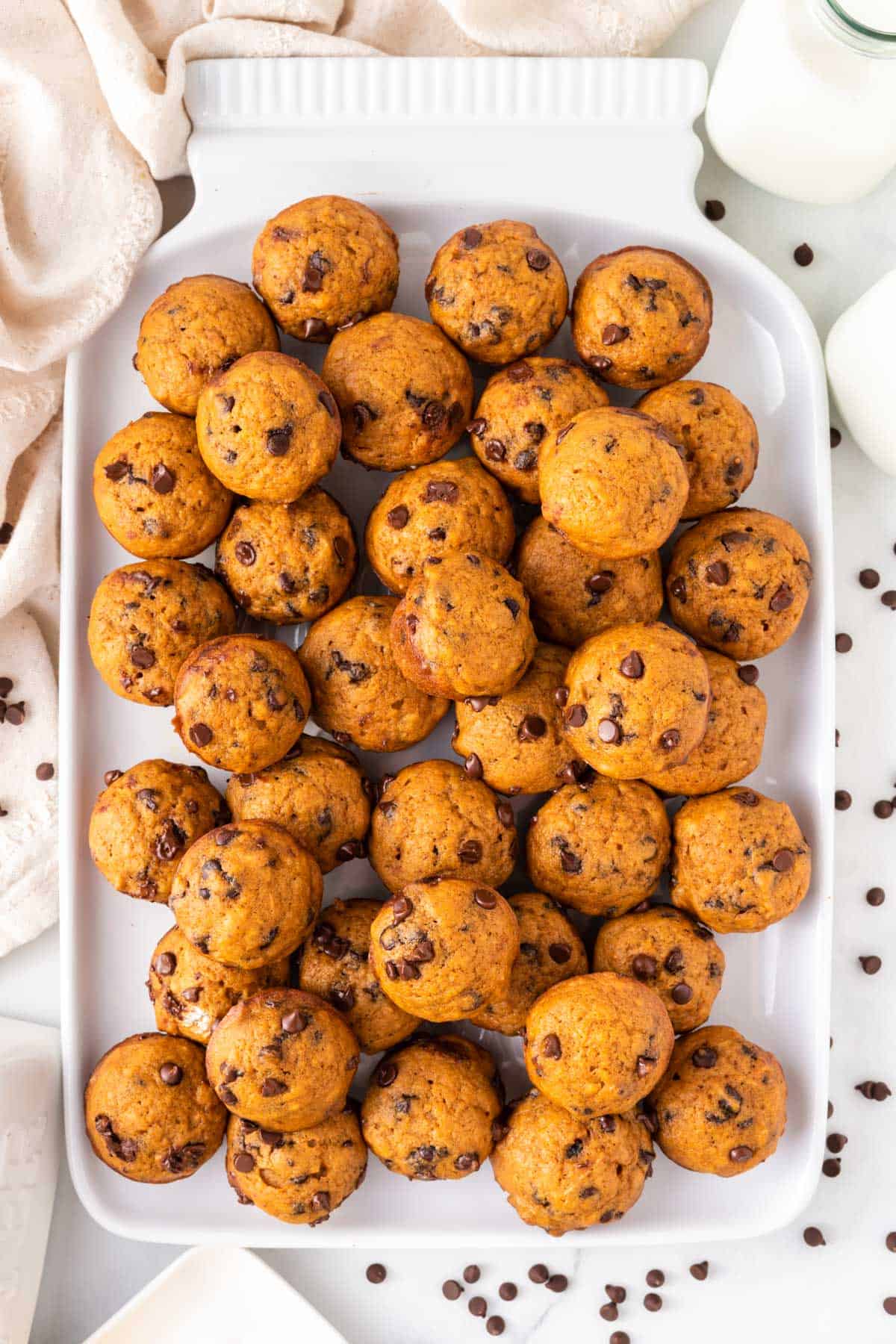 pumpkin mini muffins on a white platter