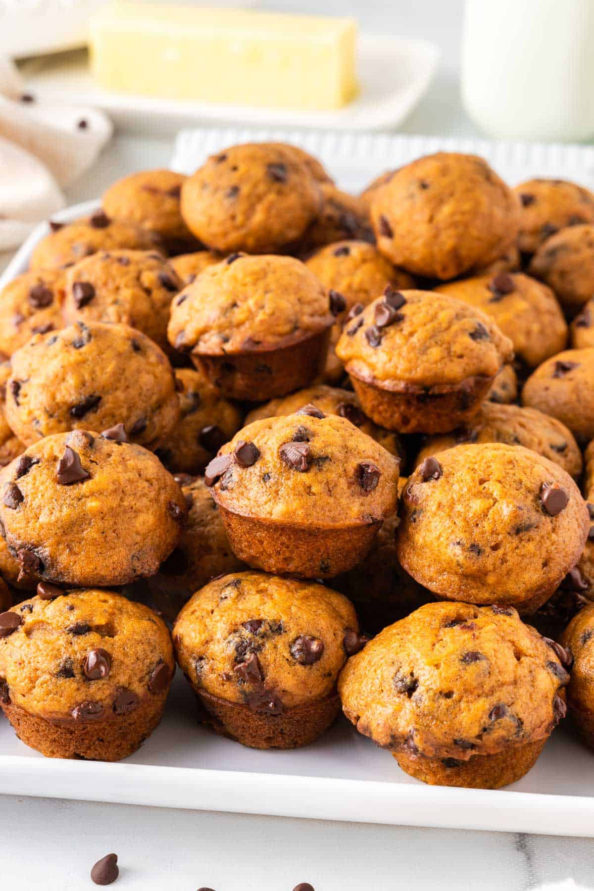 pumpkin mini chocolate chip muffins stacked