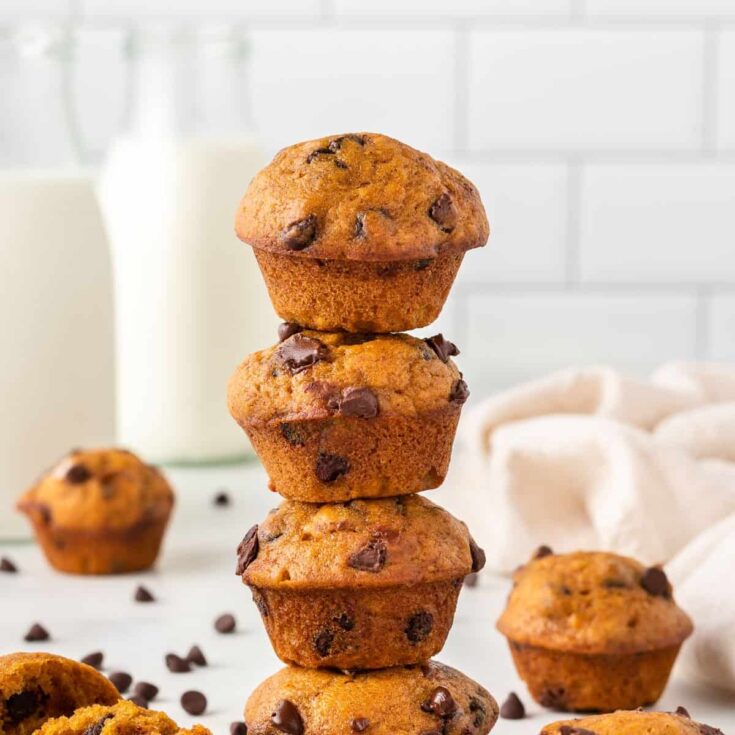 mini pumpkin muffins stacked on top of each other