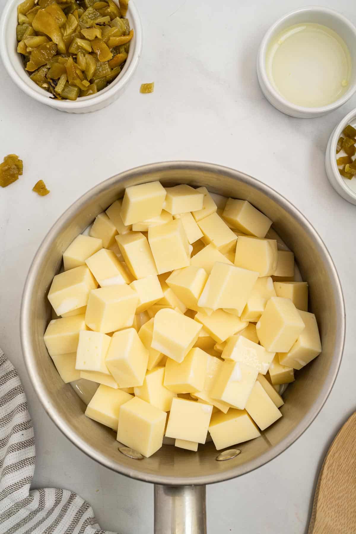 american cheese chunks in a sauce pan