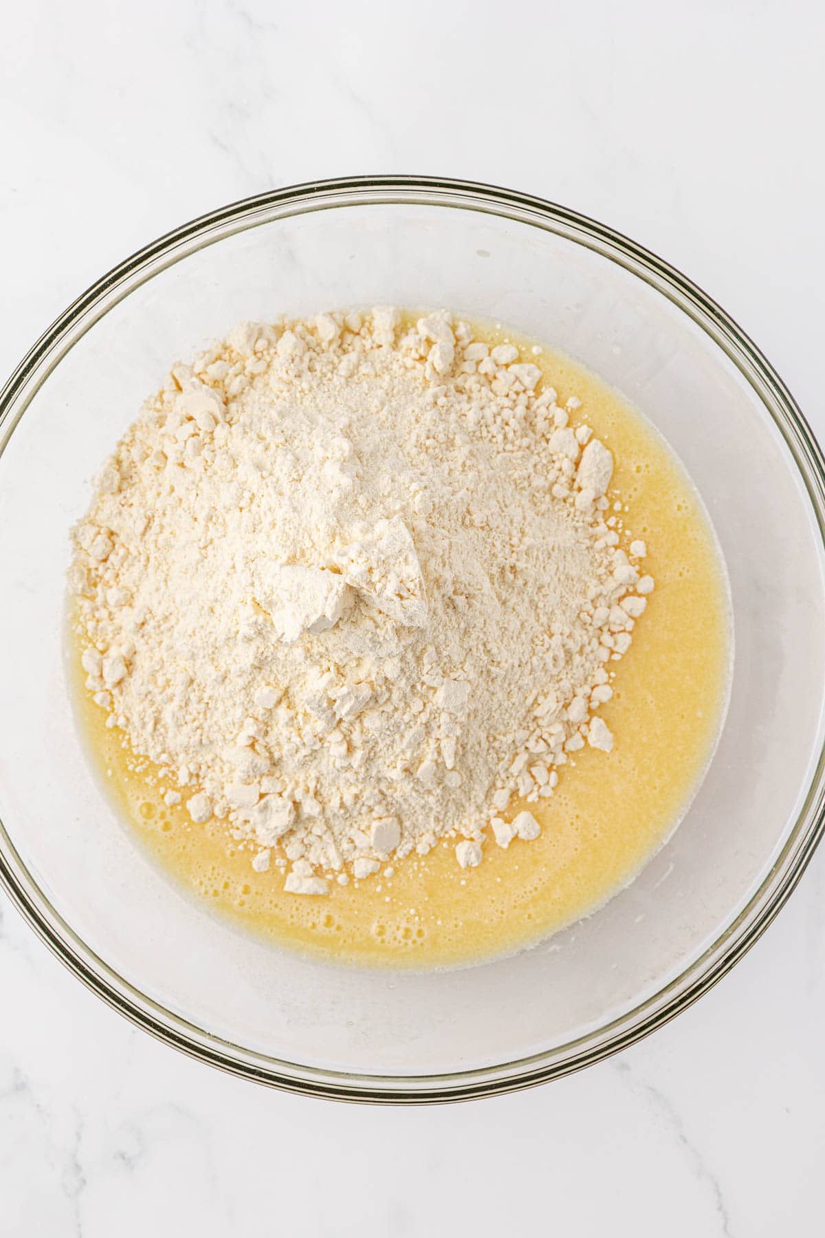 adding the cake mix to the batter