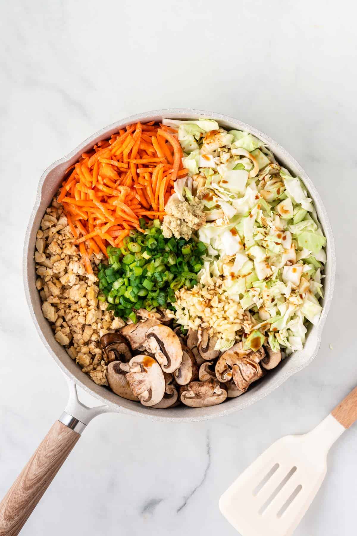 adding the rest of the veggies to the skillet