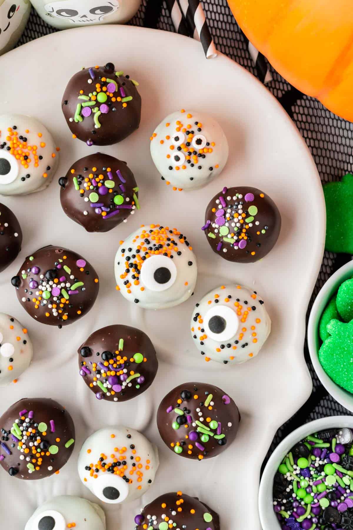 halloween decorated oreo balls on a plate