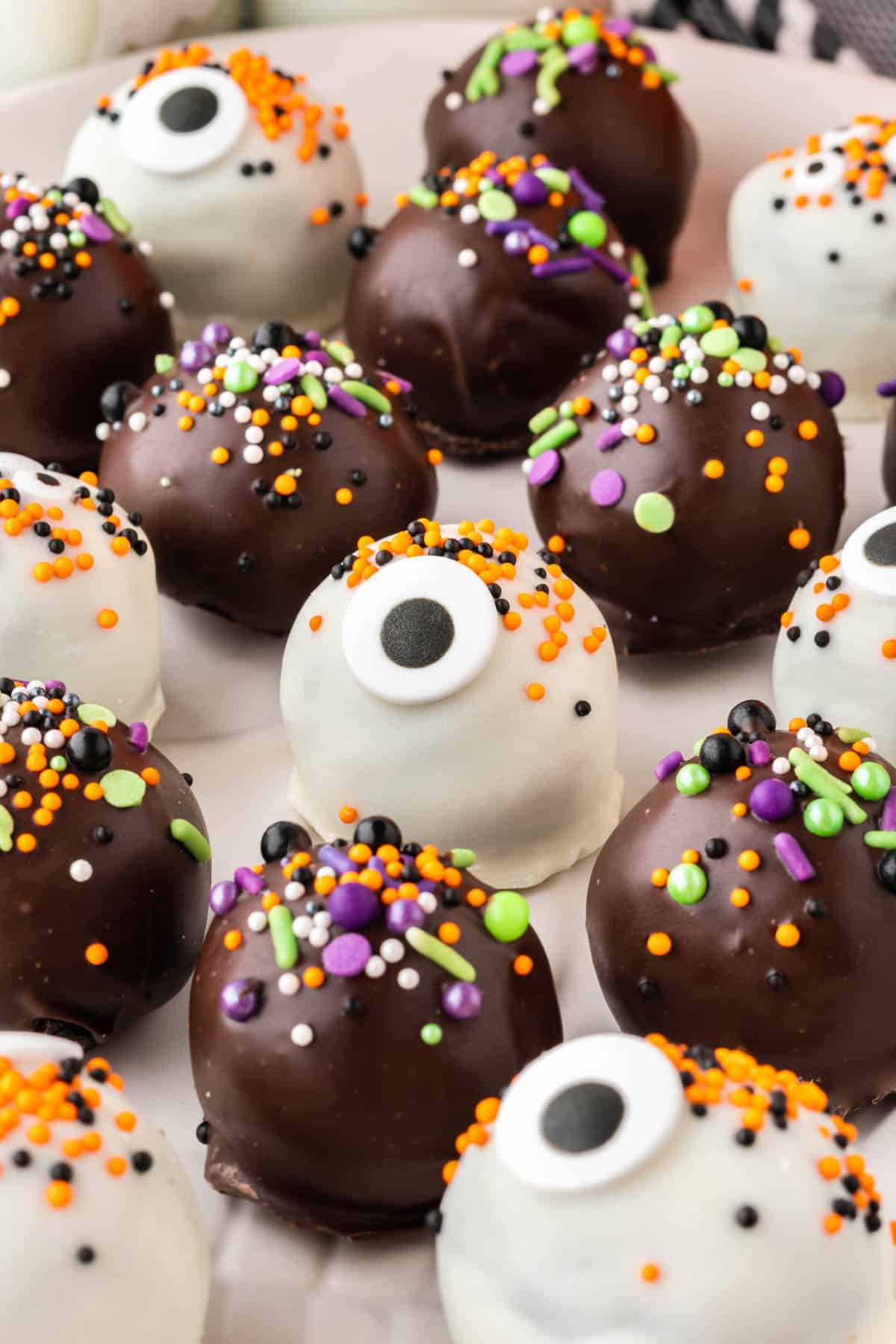 halloween decorated oreo balls on a plate