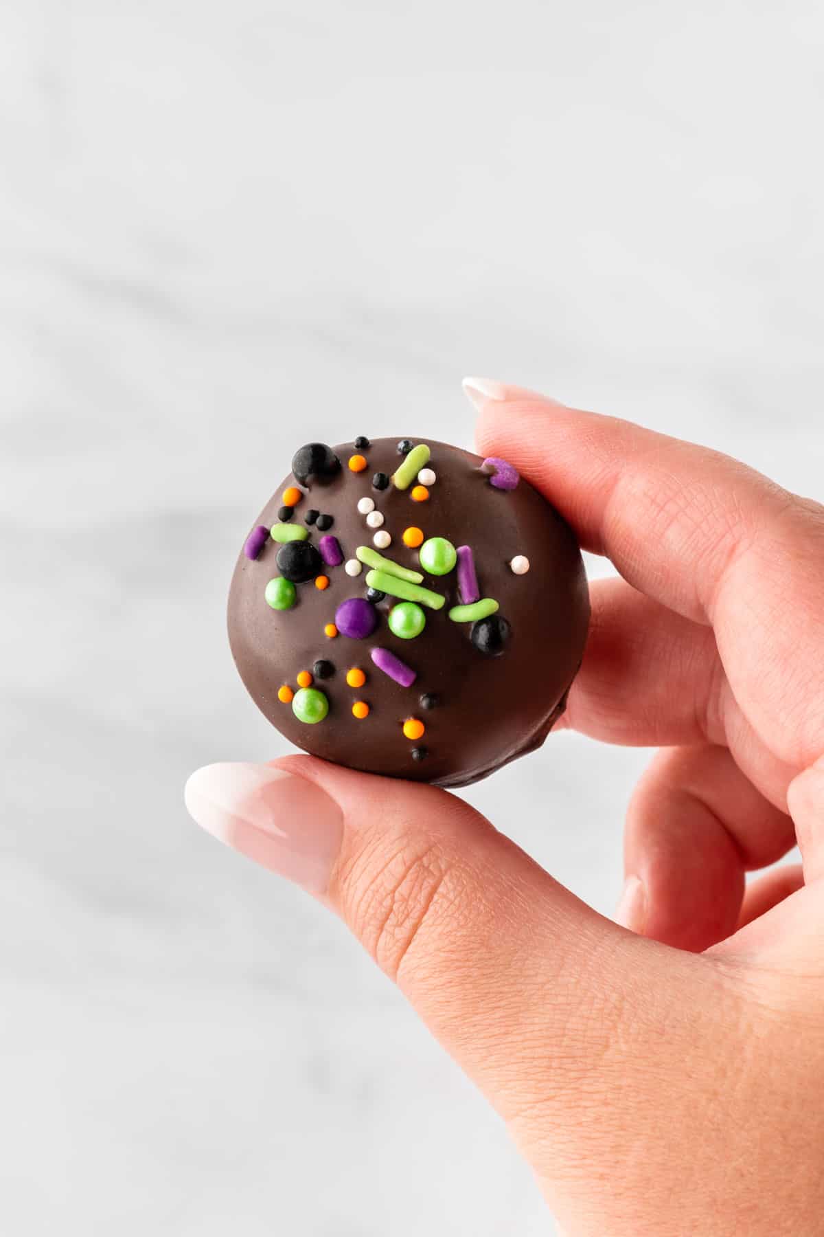 holding an oreo ball