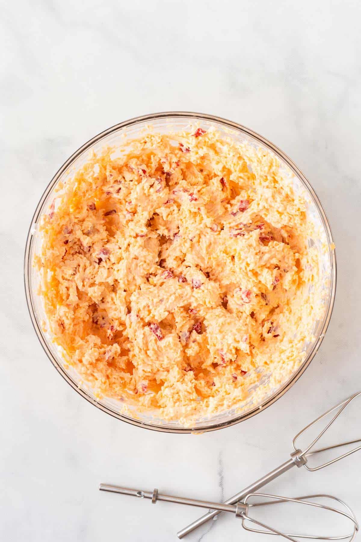 pimento cheese spread mixed together in a mixing bowl