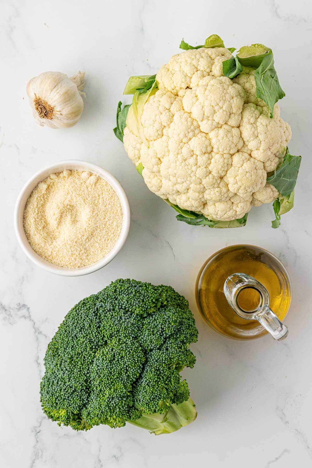garlic, parmesan cheese, cauliflower, broccoli, and olive oil