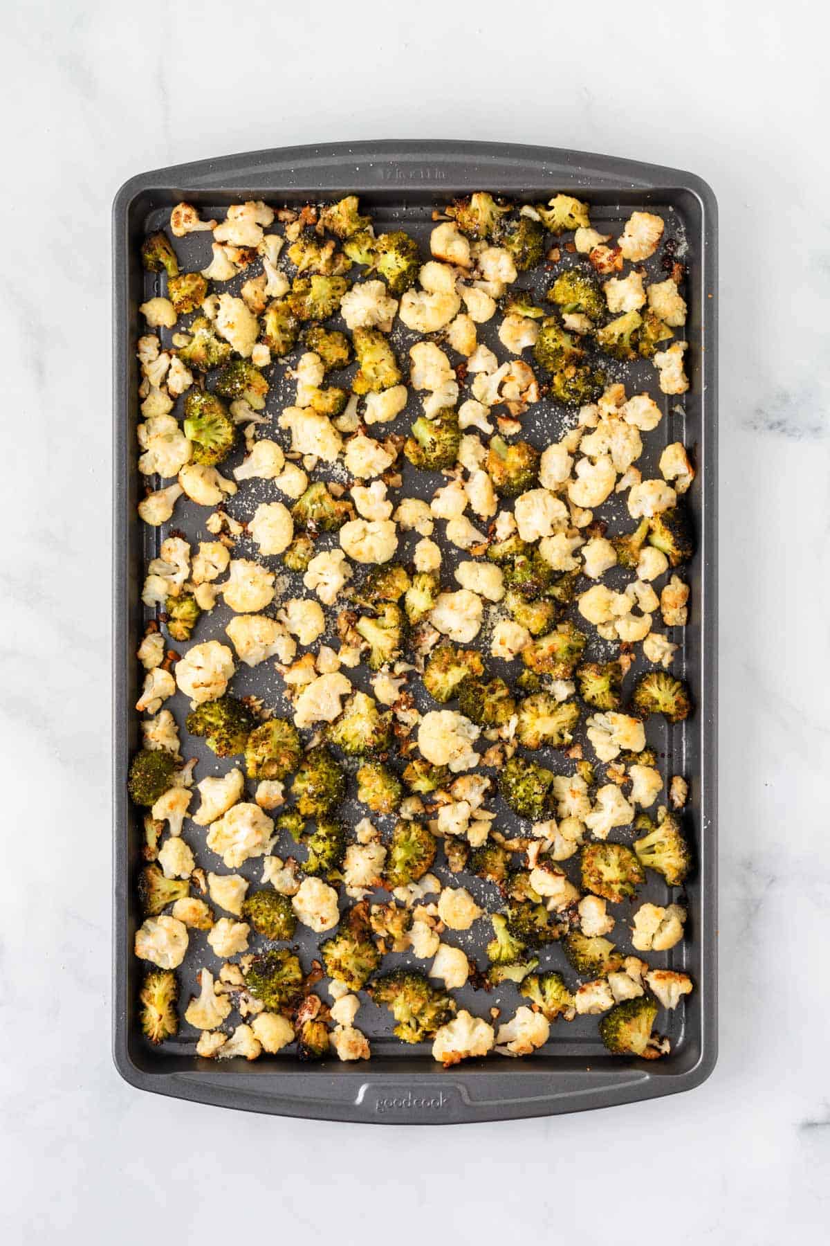 roasted broccoli and cauliflower on a baking sheet