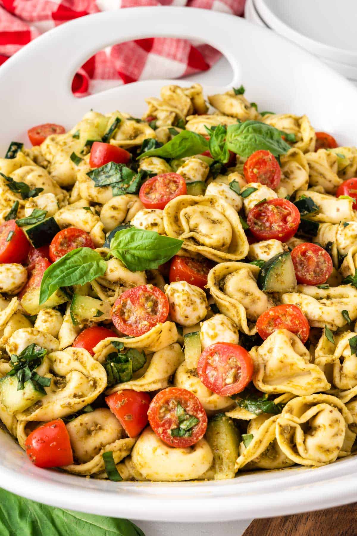 tortellini pasta salad in a white serving dish