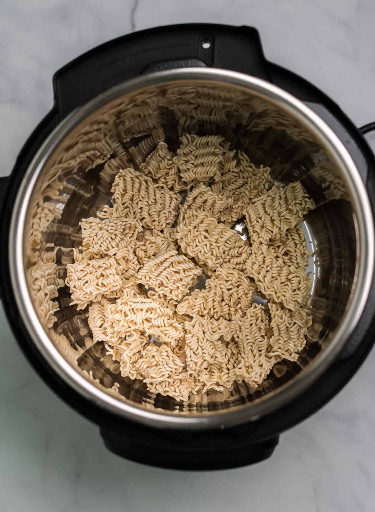 ramen noodles broken up inside an instant pot