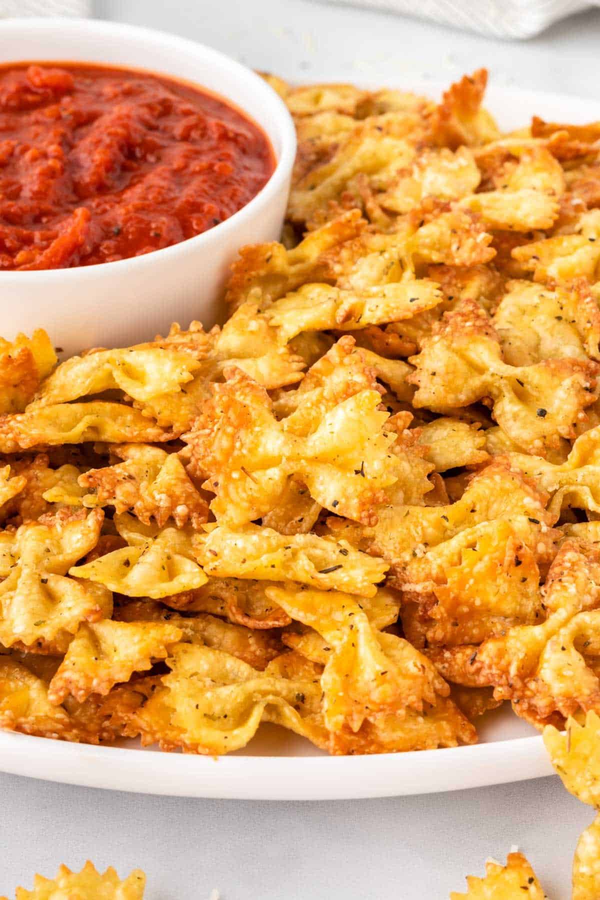 pasta chips on a plate with marinara