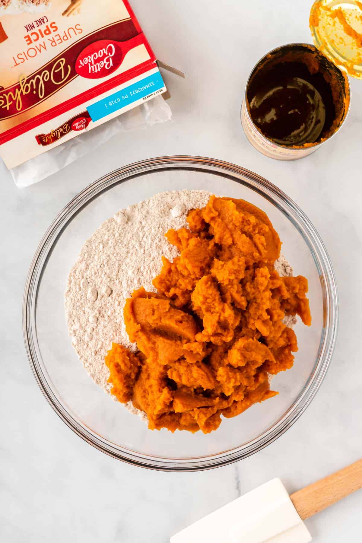 pumpkin and cake mix in a mixing bowl