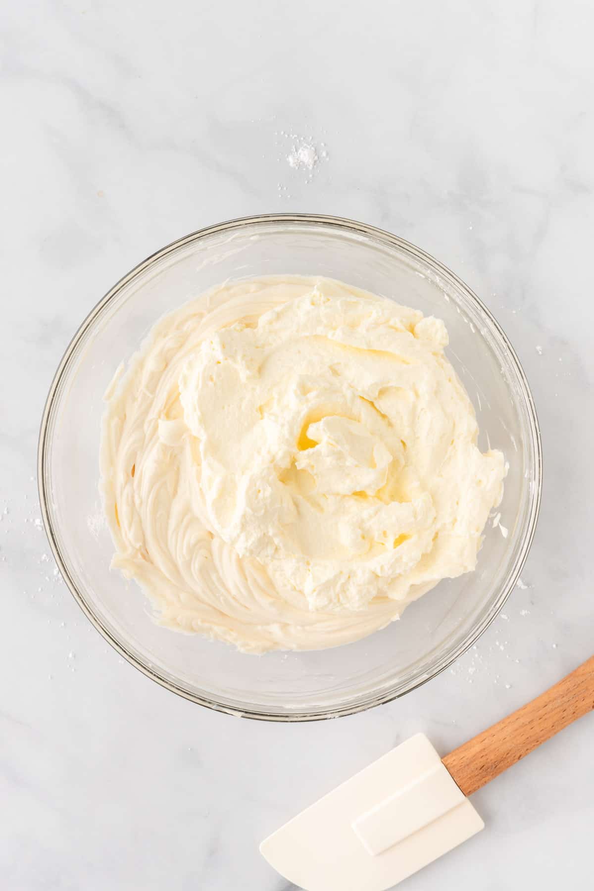 mixing the whipped cream and cream cheese together