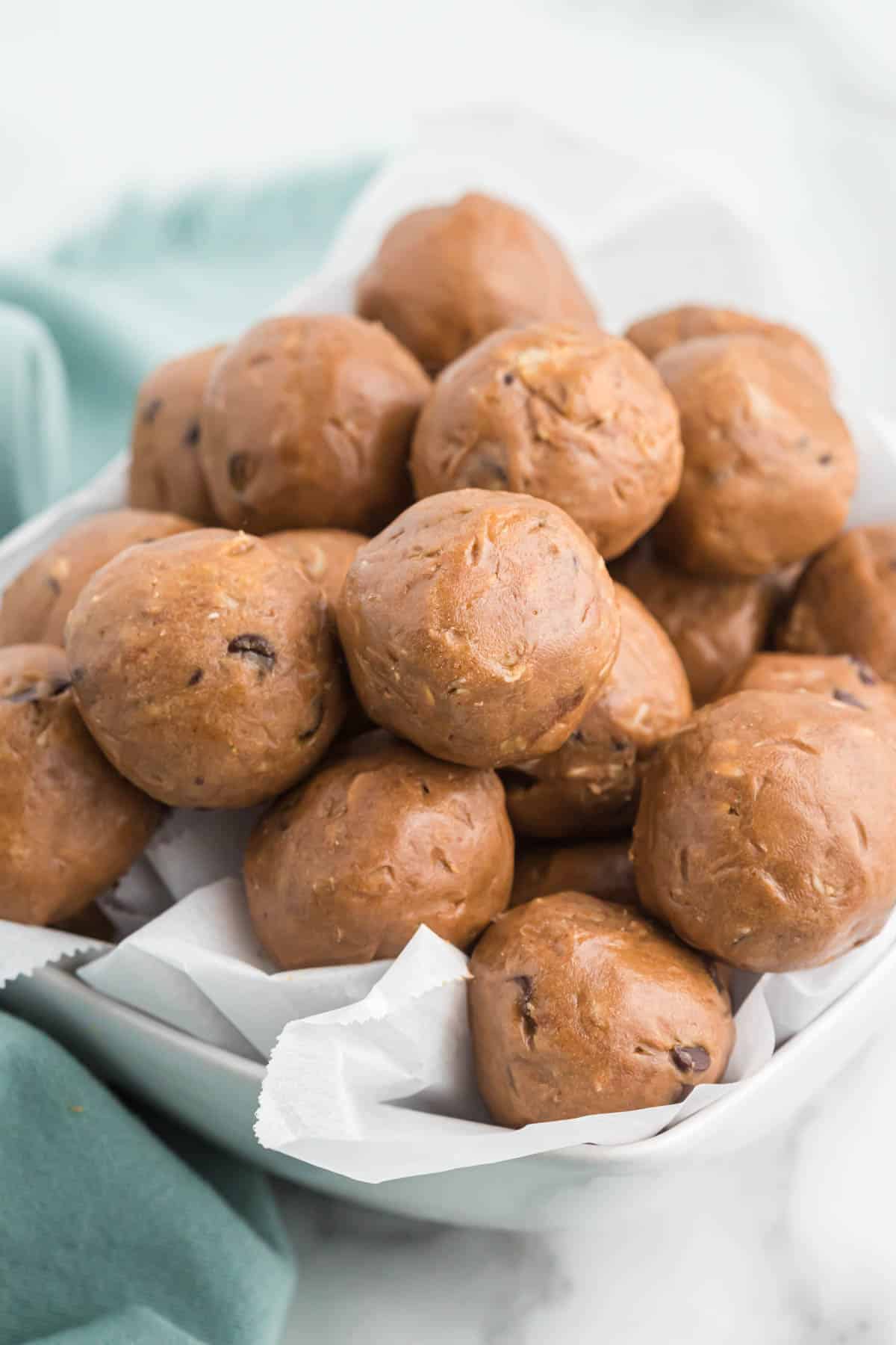 chocolate protein balls stacked in a bowl