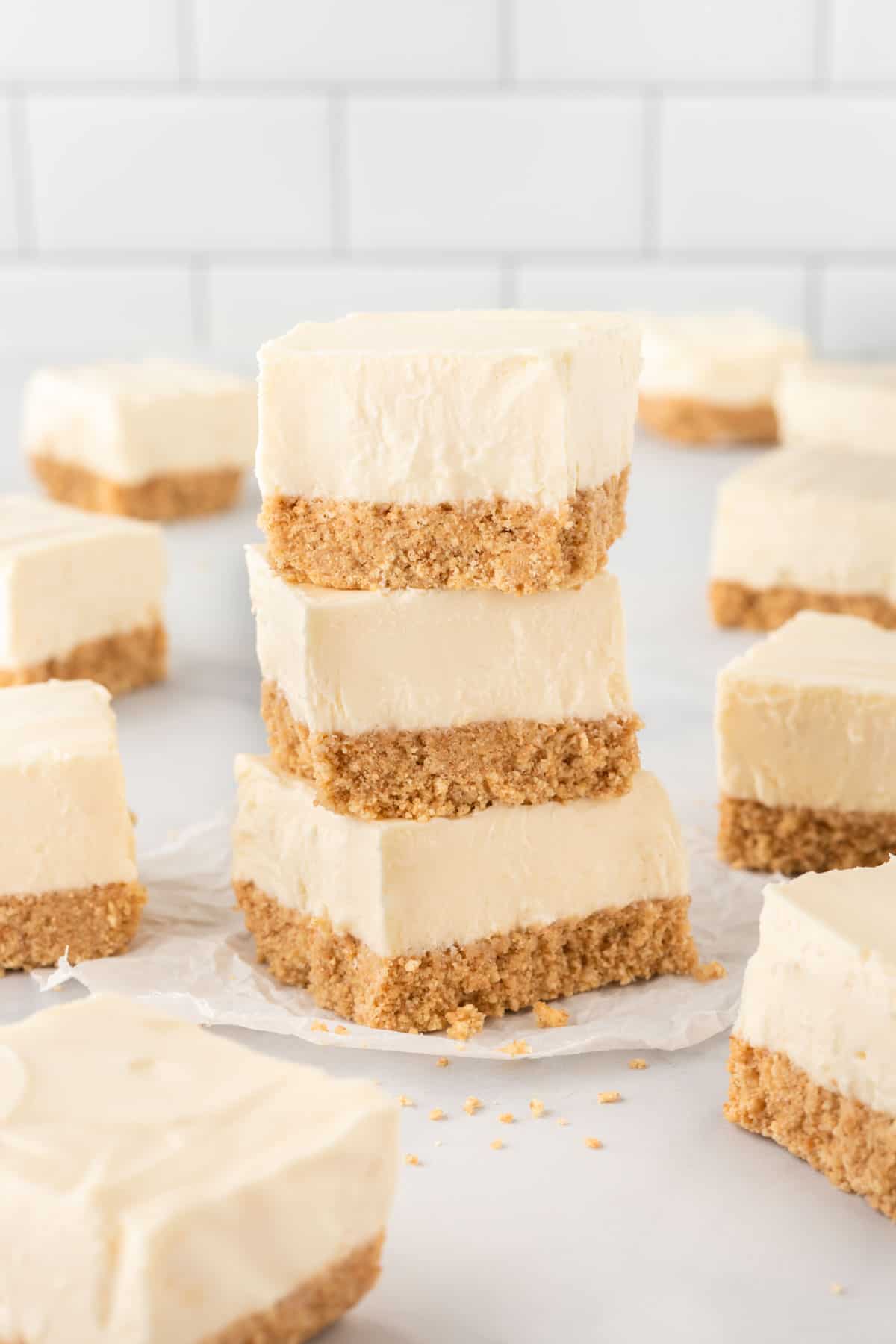 cheesecake bars stacked on top of each other